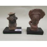 Two pre-Columbian terracotta figures of seated females with headdresses