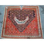 Antique Feraghan saddle rug with Boteh and Herati design on a midnight blue ground with rust