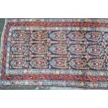 Kurdish runner with an all-over repeating Boteh design on a midnight blue ground with triple border,