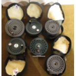 One Orvis CFO fly reel together with a quantity of unnamed spools