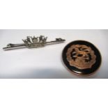 9ct Gold and tortoiseshell Hampshire Regiment brooch, 23mm diameter, together with a silver Naval