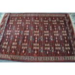 Turkoman rug with an unusual banded design in shades of madder cream and blue, 216 x 155cm The rug