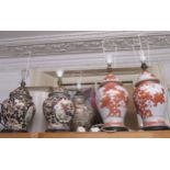 Two pairs of reproduction Chinese porcelain table lamps in the form of temple jars, together with