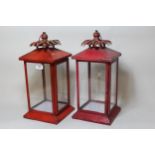 Two modern red painted toleware square form hanging lanterns, 42cm high