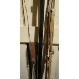 Vintage three piece Greenheart fly rod, together with another similar with two tip sections, a