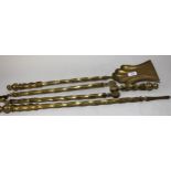 Late 19th / early 20th Century brass fireside companion set (at fault), 68cm long