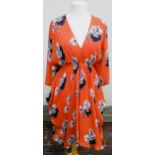 Ladies Issa dress of orange, floral and black and white print design, size S Small hole to V neck