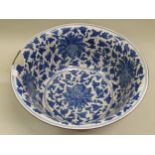 Large Chinese blue and white floral decorated bowl with brass rim, (large chip to edge below brass