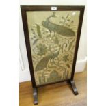 Early 20th Century oak firescreen inset with an Indian silk, metal thread and sequin picture of