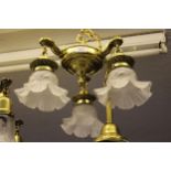 American brass hanging light fitting with three frosted floral decorated glass shades