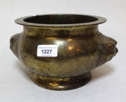 Chinese bronze two handled censer of circular squat baluster form with maskhead handles, 14 x 24cm