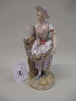 Meissen figure of a lady standing beside a tree stump with a garland of flowers, 18cm high (damages)