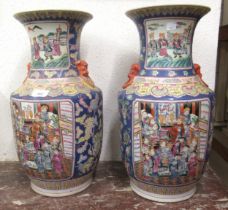 Pair of large reproduction Chinese Canton baluster form vases painted with panels of figures on a