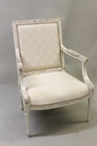 Reproduction French style painted open armchair on turned reeded front supports with cream