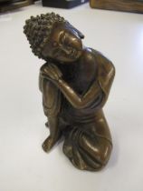 20th Century Chinese bronze figure of seated Buddha, 16cm high together with a similar carved wooden