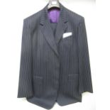 Paul Smith, pin striped suit with a pair of 2002 platinum brogues (at fault) Small holes in many