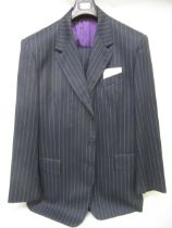 Paul Smith, pin striped suit with a pair of 2002 platinum brogues (at fault) Small holes in many