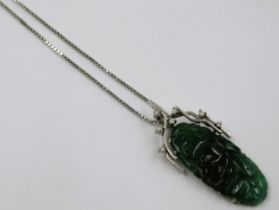 Oriental 9ct white gold diamond and jade pendant on chain, the pendant 38mm The chain is also 9ct