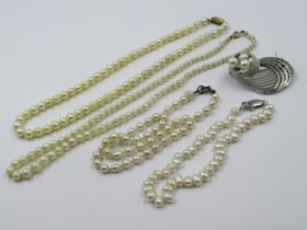 Two cultured pearl necklaces and two cultured pearl bracelets, together with a pearl and white metal