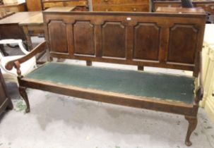 18th Century oak settle with a five fielded panel back above scroll arms and cabriole supports