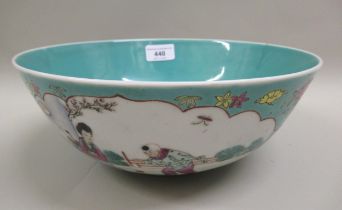 20th Century Chinese circular bowl, decorated with panels of figures in landscapes on a turquoise