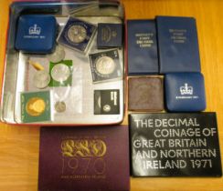 Two silver proof Elizabeth II commemorative coins in fitted boxes, two GBR coin sets for 1970 and