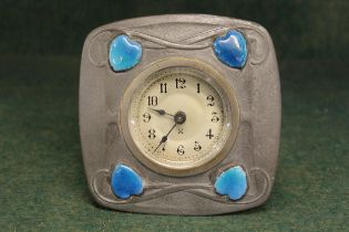 Liberty type pewter and blue enamel dressing table clock having circular silver dial with Arabic