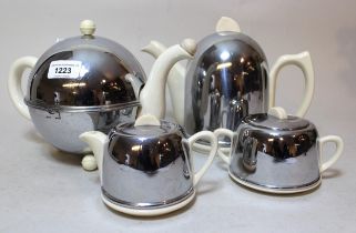 Mid 20th Century Heatmaster pottery four piece tea service with chromium heat covers