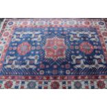 Modern Turkish rug of Caucasian design with a triple medallion and all-over stylised pattern in