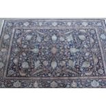 Indo Persian carpet with an all-over palmette and floral design on a midnight blue ground with