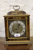 Small early to mid 20th Century black chinoiserie lacquer mantel clock with a single train movement,