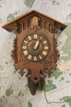 Early 20th Century oak cuckoo clock with two train weight driven movement