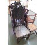 19th Century oak hall chair with carved back and turned supports with a bentwood armchair and a rush