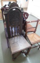 19th Century oak hall chair with carved back and turned supports with a bentwood armchair and a rush