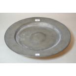 Circular pewter shallow bowl inscribed VR, 43cm diameter