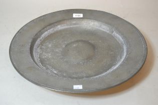 Circular pewter shallow bowl inscribed VR, 43cm diameter