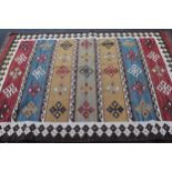 Modern Kelim rug with a horizontal banded design in shades of green, yellow, blue and red, 234 x