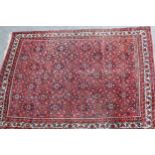 Hamadan carpet with all-over Herati design on a red ground with borders, 310 x 215cm (slight wear)