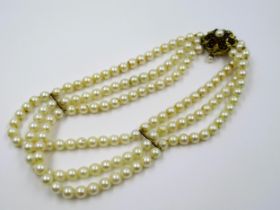 Triple row uniform cultured pearl choker with 9ct gold garnet and cultured pearl set clasp with