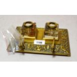 Late 19th / early 20th Century brass inkstand having two cut glass bottles (covers at fault), 22cm