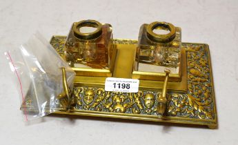 Late 19th / early 20th Century brass inkstand having two cut glass bottles (covers at fault), 22cm