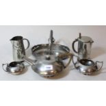 English pewter three piece tea service of circular squat beaten design, No. 04483 together with a