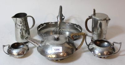 English pewter three piece tea service of circular squat beaten design, No. 04483 together with a