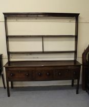 George III oak dresser, the open shelf back above an arrangement of drawers, 197cm high x 181cm wide