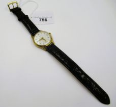Gentleman's 9ct gold cased wristwatch by Garrards, the silvered dial with Arabic and baton numerals,