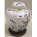 Early 20th Century Canton enamel ginger jar and cover decorated with various vases of cut flowers,