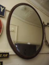 Large Edwardian oval mahogany chequer inlaid bevel edged hanging wall mirror, 95 x 74cm Good