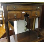Small walnut lowboy in early 18th Century style with three drawers surrounding a shaped apron