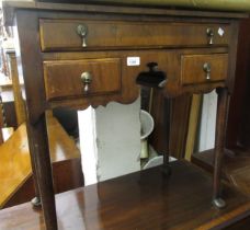 Small walnut lowboy in early 18th Century style with three drawers surrounding a shaped apron