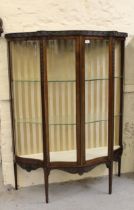 Early 20th Century mahogany serpentine shaped two door display cabinet with blind fretwork